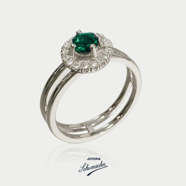 Anillo en oro blanco con esmeralda redonda rodeada de brillantes | Joyería Schumacher