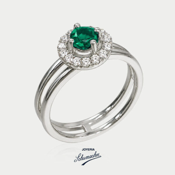 Anillo en oro blanco con esmeralda redonda rodeada de brillantes | Joyería Schumacher