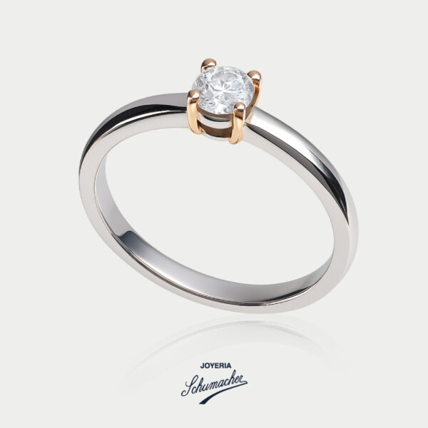 Anillo en oro blanco con brillante de 0.23 kilates y uñas en oro amarillo | Joyería Schumacher